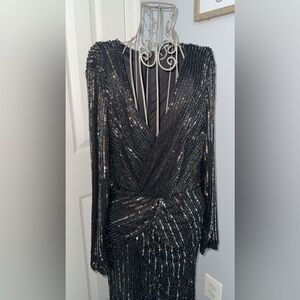 Beautiful long sleeve evening Gown. New with tags.
